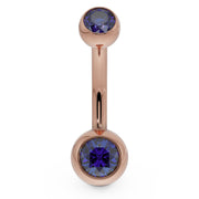 14k rose gold double CZ belly button ring with blue bezel-set stones, front view