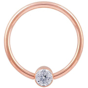 14k rose gold CZ bezel fixed bead ring, closer crop emphasizing the bezel-set cubic zirconia detail