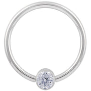14k white gold CZ round bezel fixed bead ring, angled view highlighting the sleek polished hoop profile