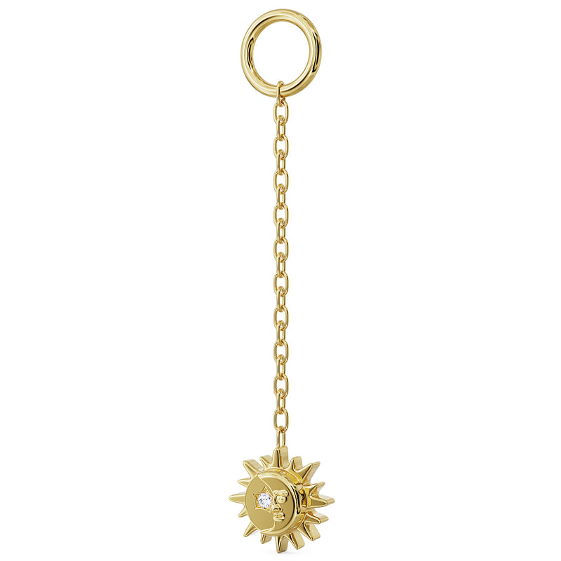 Close-up of 14K yellow gold sun and moon charm with diamond accent on long dangle chain