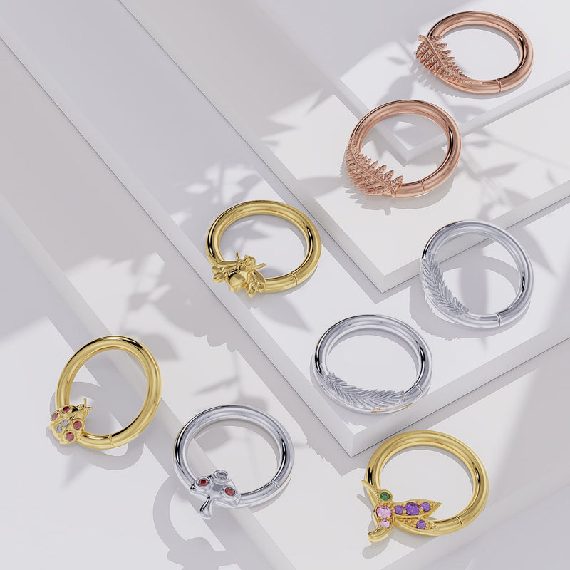 14K gold hummingbird seamless ring shown alongside other nature-themed gold seam ring styles