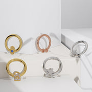 14K gold infinity seam ring shown alongside other symbol hoops in yellow, rose, and white gold
