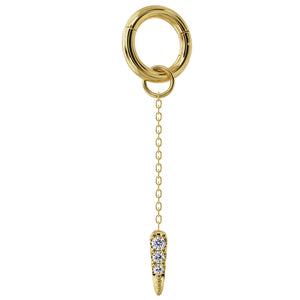 14K yellow gold diamond spike chain accessory clipped onto a segment ring, showing attachment method