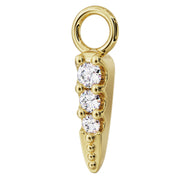 Side profile of 14k yellow gold diamond spike charm showing depth of prong settings and tapered point