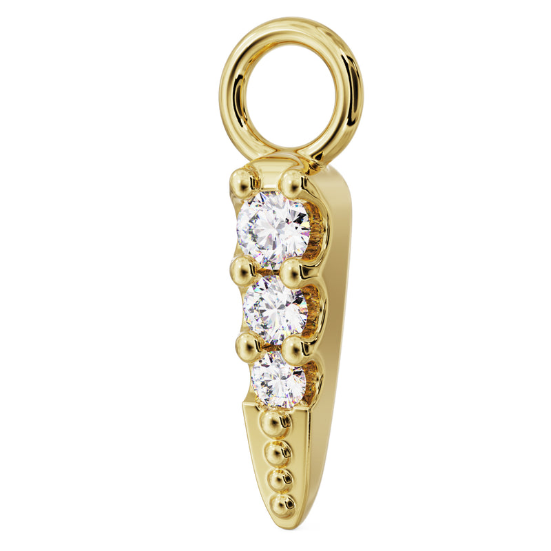 Side profile of 14k yellow gold diamond spike charm showing depth of prong settings and tapered point