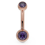 14k rose gold double CZ belly ring with purple bezel-set stones, front view