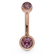 14k rose gold double CZ belly ring with pink bezel-set stones, front view