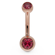 14k rose gold double CZ belly button ring with red bezel-set stones, front view