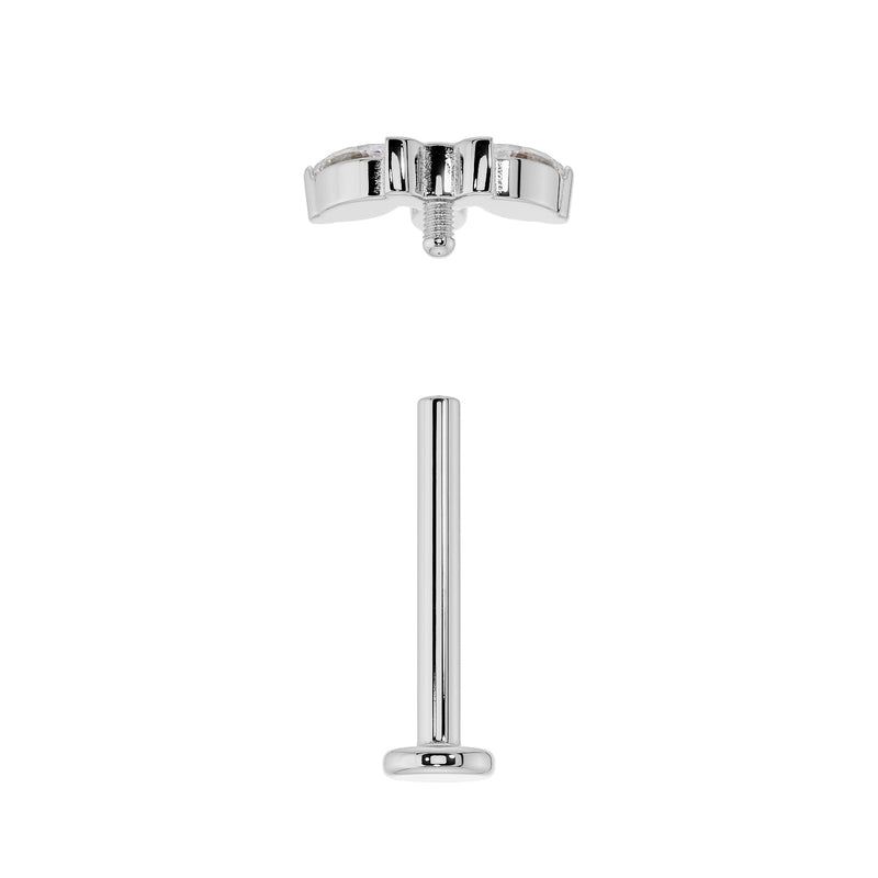 Exploded view of white gold flat back labret showing threaded top and flat back post separated