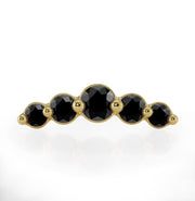 Close-up front view of 14K yellow gold black diamond climber charm showing 5 graduated stones