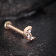 14K rose gold crescent moon diamond pave flat back stud on dark stone surface, close-up detail