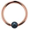 14K rose gold captive bead ring with blue-green iridescent peacock pearl, front view