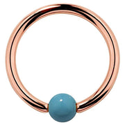 14K rose gold captive bead ring with faux turquoise 3mm bead, warm pink-gold hoop front view