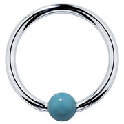 14K white gold captive bead ring with faux turquoise bead, high-polish silver-tone hoop front view