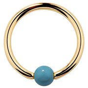 14K yellow gold captive bead ring with faux turquoise 3mm bead, polished hoop front view