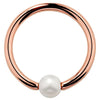 14K rose gold captive bead ring with white cultured pearl, warm-toned hoop front view