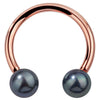 14K rose gold circular barbell with genuine peacock pearl ends, front view