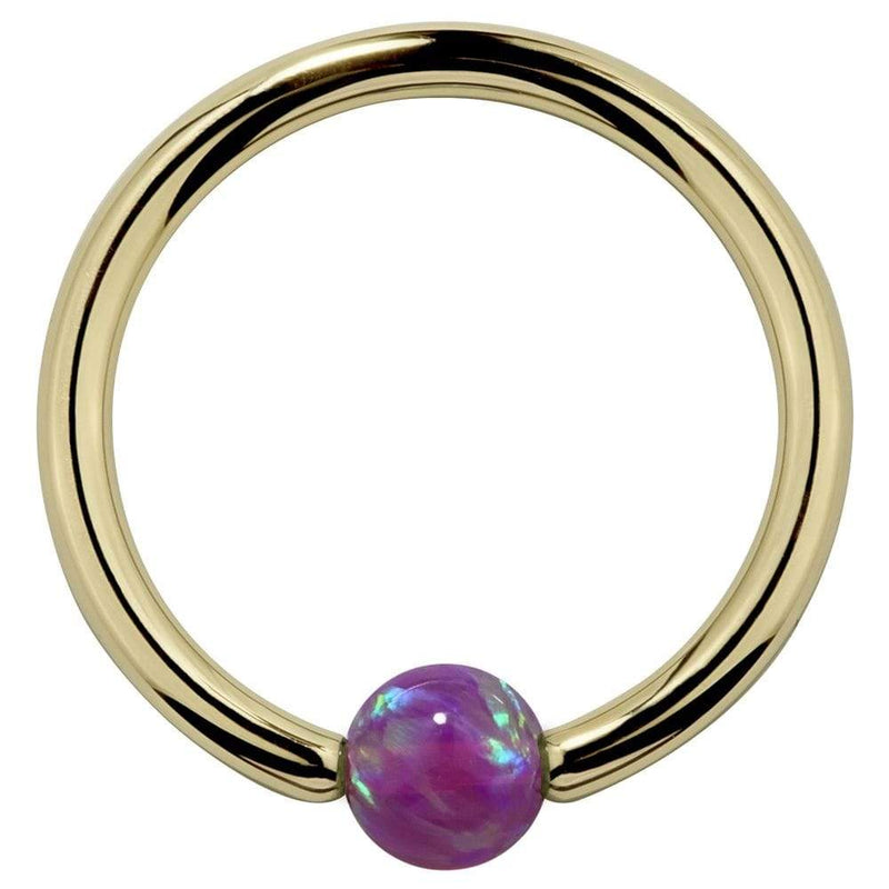 14K yellow gold captive bead ring with purple opal bead, front view on white background