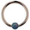 14K rose gold captive bead ring with teal simulated opal bead, front view on white background
