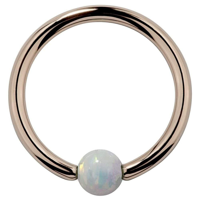 14K rose gold captive bead ring with white opal ball, front view showing warm pink-gold tone