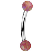 Pink simulated opal curved barbell in 14K white gold, side view with iridescent opal ends