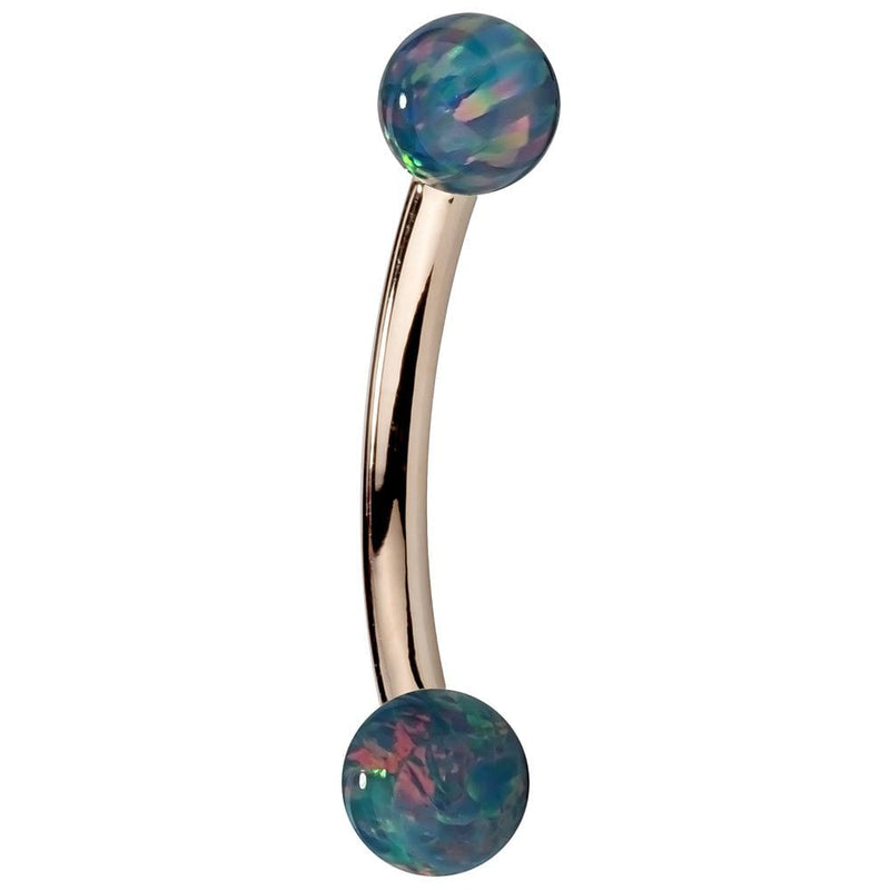 14K rose gold curved barbell with teal simulated opal ball ends, side view