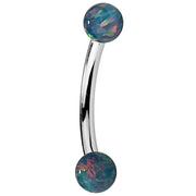 14K white gold curved barbell with teal simulated opal ball ends, side view