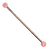 14k rose gold industrial barbell with pink synthetic opal ball ends, front view on white background