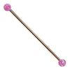14k rose gold industrial barbell with purple synthetic opal ball ends, front view on white background