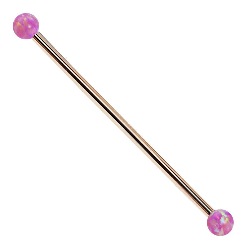 14k rose gold industrial barbell with purple synthetic opal ball ends, front view on white background