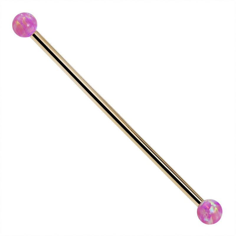 14k yellow gold industrial barbell with purple synthetic opal ball ends, front view on white background