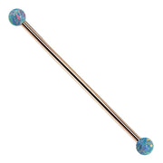 Teal opal 14k rose gold industrial barbell with colorful synthetic opal ball ends, full length view