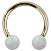 14k yellow gold circular barbell with iridescent white opal balls, front view