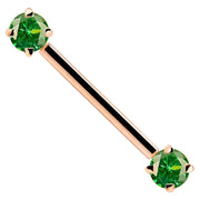 14k rose gold straight barbell with dual prong-set round green CZ ends, angled product view