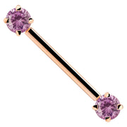 14k rose gold straight barbell with pink CZ gemstone ends, showing warm rose tone contrast