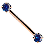 14k rose gold straight barbell with dual blue CZ prong-set ends, angled product view