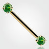 14k yellow gold straight barbell with dual prong-set round green CZ ends, angled view