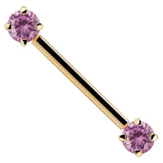 14k yellow gold straight barbell with pink round CZ ends, close-up showing prong detail
