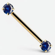 14k yellow gold straight barbell with dual blue CZ prong-set ends, angled product view