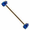 14k yellow gold industrial barbell with dual blue teardrop CZ gems in prong settings, diagonal view
