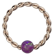 14K rose gold twisted captive bead ring with purple opal bead, front view on white background