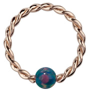 14K rose gold twisted captive bead ring with teal simulated opal bead, front view