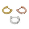 All three metal options of 13mm diamond huggie hoops side by side: yellow gold, rose gold, and white gold