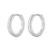 Pair of 14k white gold 10mm huggie hoop earrings shown together, polished silver-toned finish