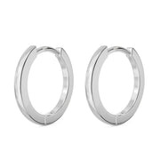 14k white gold huggie hoop earrings, pair shown at an angle with high-polish silver-tone finish