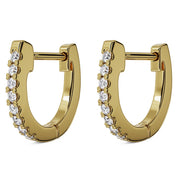 Pair of 14k yellow gold diamond huggie hoop earrings, angled view showing hinged clasp and sparkle detail