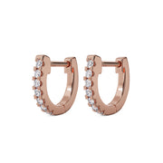 Pair of 14k rose gold 8mm diamond huggie hoop earrings, front view with prong-set diamond row