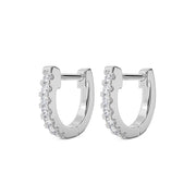 Pair of 14k white gold 8mm diamond huggie hoop earrings, angled front view showing prong-set diamonds