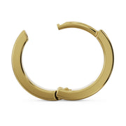 Side profile of 14k yellow gold 8mm huggie hoop earring showing open hinge and band thickness