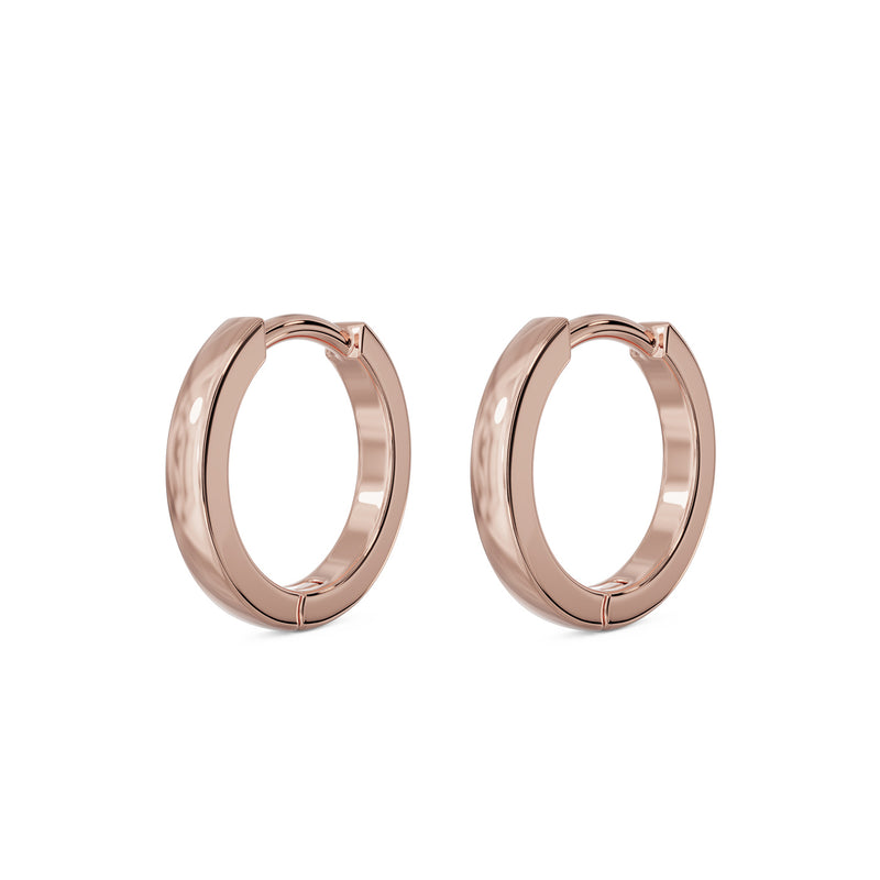 Matched pair of 14k rose gold 8mm huggie hoop earrings, angled view showing warm pink tone